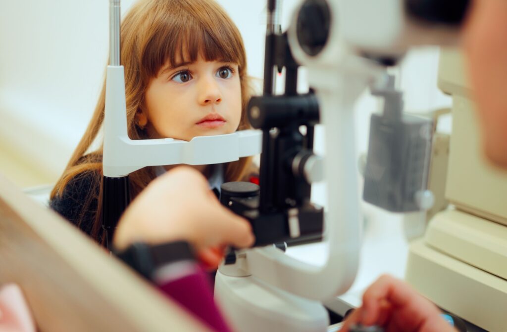 A young girl with one eye turned in at the eye doctor for vision therapy to help treat amblyopia and strabismus.