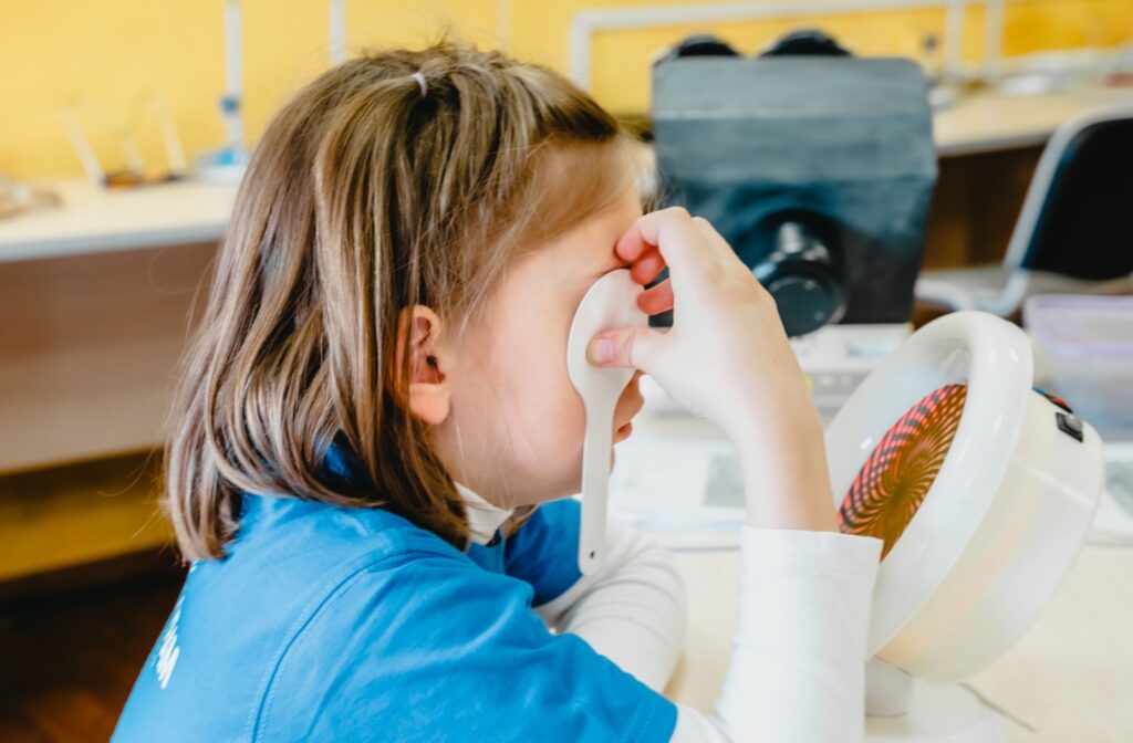 A child performs vision therapy exercises to correct underlying visual problems.